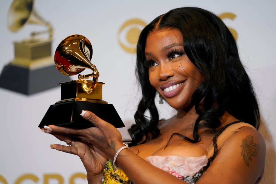 FILE - SZA, winner of the award for best pop duo/group performance for "Kiss Me More," poses in the press room at the 64th Annual Grammy Awards on April 3, 2022, in Las Vegas. SZA received nine Grammy nominations on Friday. (AP Photo/John Locher, File)