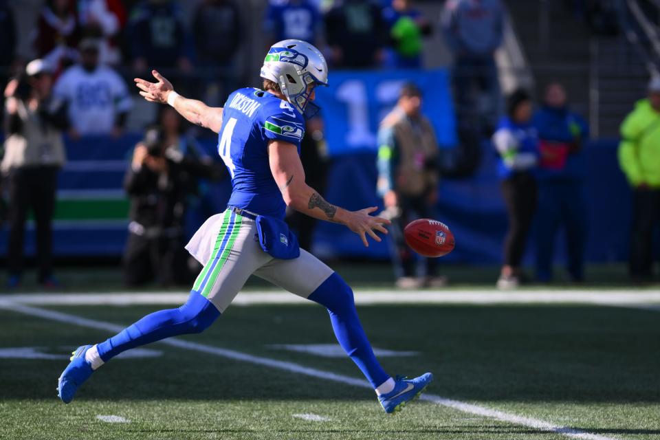 Michael Dickson punts the ball against the Cleveland Browns at Lumen Field on Oct. 29, 2023.