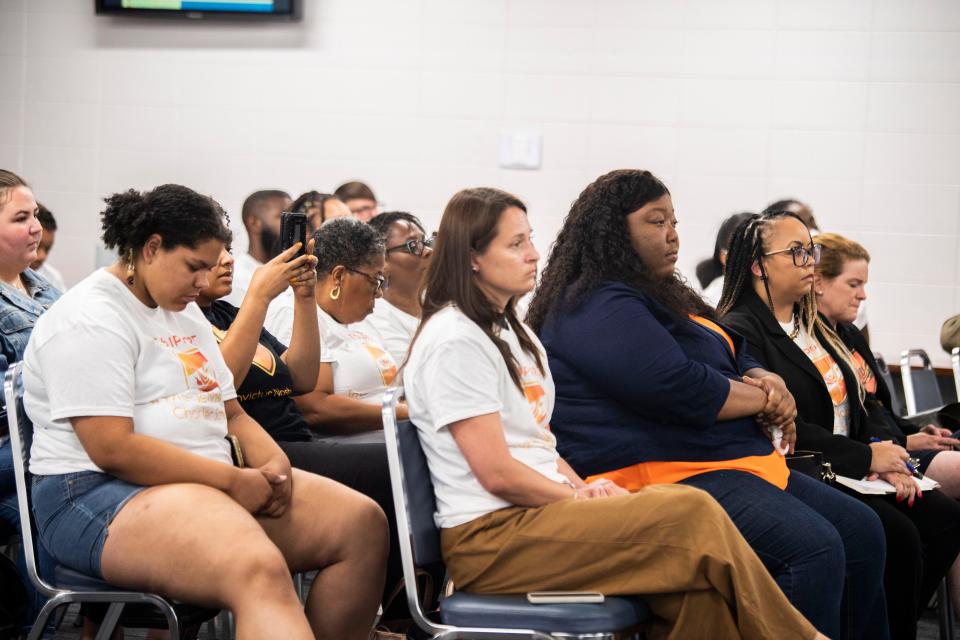 Supporters of Invictus Nashville Charter School including the founder, Brenda Jones, all sit inside the school board meeting room listening to the school board discuss the future of the charter schools at MNPS administration building in Nashville, Tenn., Tuesday, July 25, 2023.