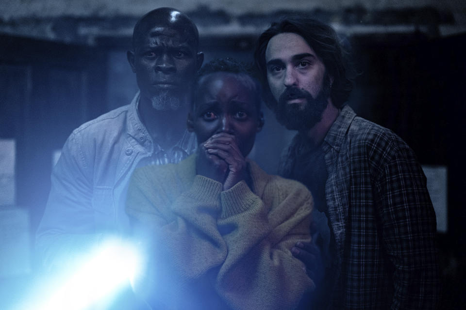 This image released by Paramount Pictures shows Djimon Hounsou, from left, Lupita Nyong'o and Alex Wolff in a scene from "A Quiet Place: Day One." (Gareth Gatrell/Paramount Pictures via AP)