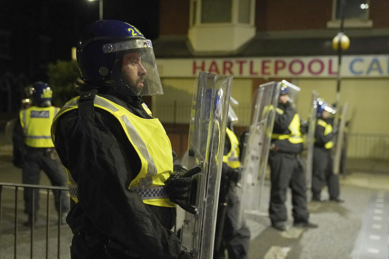 Thousands of police were deployed to the streets of England in response to the riots. (AP)