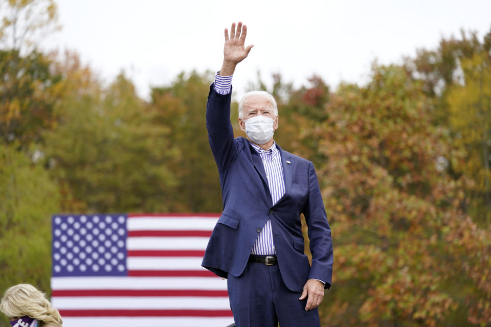 Democratic presidential candidate former Vice President Joe Biden waves during a campaign stop at Bucks County Community College, Saturday, Oct. 24, 2020, in Bristol, Pa. (AP Photo/Andrew Harnik)