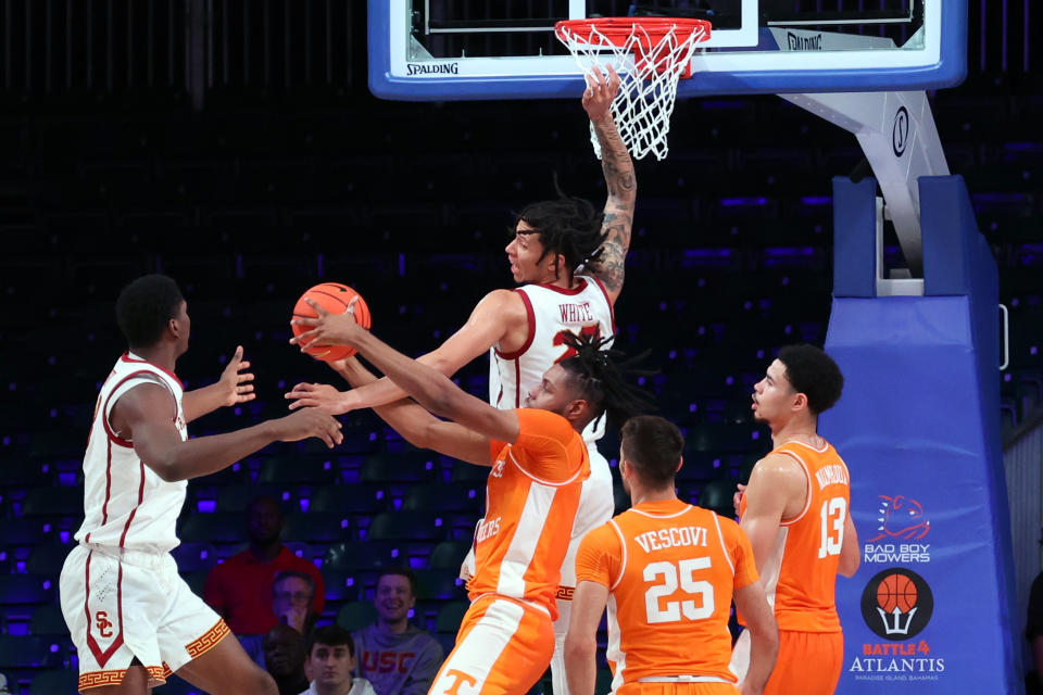 In a photo provided by Bahamas Visual Services, Tennessee's Jonas Aidoo, center, battles for a rebound during an NCAA college basketball game against Southern California in the Battle 4 Atlantis at Paradise Island, Bahamas, Thursday, Nov. 24, 2022. (Tim Aylen/Bahamas Visual Services via AP)