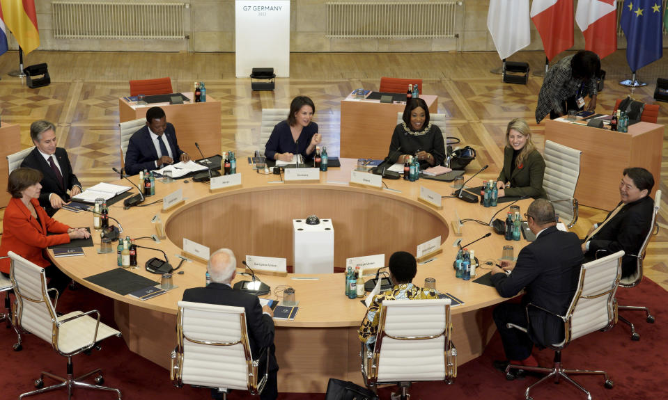 Clockwise from left, the Foreign Minister of France, Catherine Colonna, Secretary of State of the United States, Antony Blinken, the Foreign Minister of the Republic of Ghana, Alfred Mutua, German Foreign Minister Annalena Baerbock, the Foreign Minister of the Republic of Ghana, Shirley Ayorkor Botchwey, Canadian Foreign Minister Melanie Joly, Japan's Foreign Minister Yoshimasa Hayashi, the Foreign Minister of Great Britain, James Cleverly, the Vice Chair of the African Union Commission, Monique Nsanzabaganwa and the EU Representative for Foreign Affairs, Josep Borrell, pose for a photo at the Historic Town Hall during the G7 Foreign Ministers Meeting in Muenster, Germany, Friday, Nov. 4, 2022. (Bernd Lauter/Pool Photo via AP)