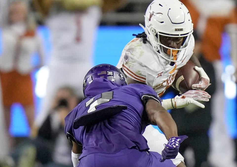 Texas running back CJ Baxter fights for extra yardage during the fourth quarter. He finished out the final two drives in place of Jonathon Brooks. Baxter, a freshman who was a five-star recruit, must step up in Brooks' absence.