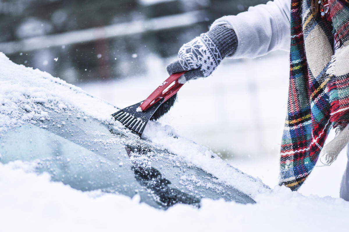 Ice Scraping En Defrost Spray On Car Windscreen High-Res Stock