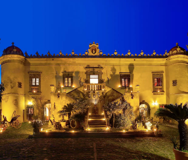 <p>Courtesy Image</p><p>Tucked away in Sicily between the town of Taormina and <a href="https://www.mensjournal.com/adventure/mount-etna-skiing" rel="nofollow noopener" target="_blank" data-ylk="slk:Mount Etna;elm:context_link;itc:0;sec:content-canvas" class="link ">Mount Etna</a>, <a href="https://www.castellosanmarco.it/en/hotel/" rel="nofollow noopener" target="_blank" data-ylk="slk:Castello San Marco;elm:context_link;itc:0;sec:content-canvas" class="link ">Castello San Marco</a> delivers the comforts of a refined spa hotel inside a baroque 17th-century coastal castle. The entire hotel is surrounded by a flourishing garden and looks over the Mediterranean.</p><p>Amenities include a tennis court, outdoor pool, and spa offering a full range of health and body treatments. The hotel’s private beach is equipped with umbrellas and sun beds during summer.</p><p>The famous Mastri Flavetta restaurant offers traditional Mediterranean cuisine with organic vegetables grown locally. A wine bar offers visitors the opportunity to taste local Sicilian vintages in a former winery.</p><p>The property's 28 rooms and suites surround the original castle building, each equipped with free WiFi. The rooms differ greatly, from the cozy classic doubles to "Grand Suites" with heated pools (one has an internal pool and the other external) and stunning views of the Etna volcano. Closest airport: Catania.</p><p>[<span>booking.com</span>]</p>