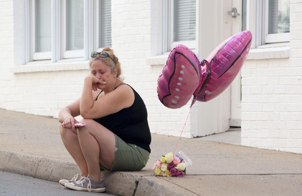 <p>A woman mourns at the corner of Fourth Street and Water Street, where a car plughed into a crowd of people at a rally, Charlottesville, Virginia, USA, 13 August 2017. According to media reports at least one person was killed and 19 injured after the car hit a crowd of people counter-protesting the ‘Unite the Right’ rally which was scheduled to take place in Charlottesville on 12 August. At least 15 others were injured in clashes during protests. (Tasos Katopodis/EPA/REX/Shutterstock) </p>