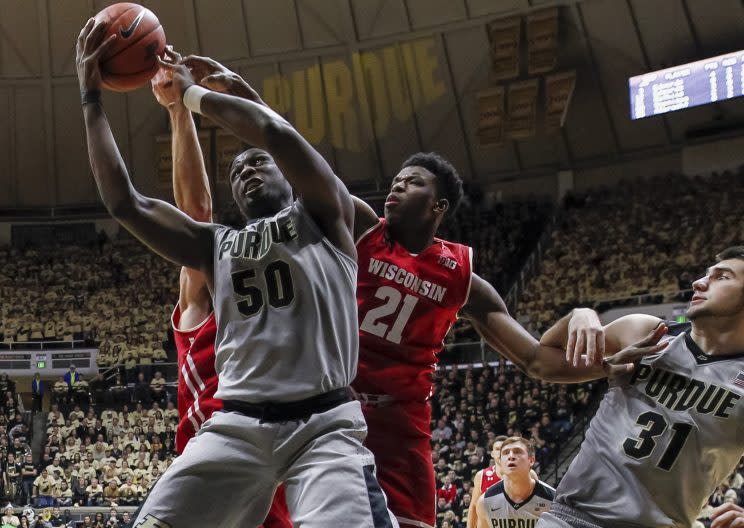 Caleb Swanigan (50) and Isaac Haas (not pictured) were big — figuratively and literally — against Wisconsin in a 66-55 win Sunday. (Getty)