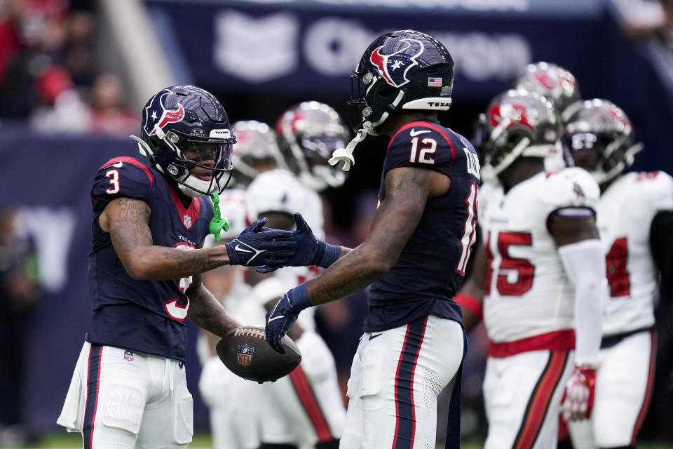 Houston Texans wide receiver Tank Dell (3) celebrates his touchdown reception with wide receiver Nico Collins (12) during the second half of an NFL football game against the Tampa Bay Buccaneers, Sunday, Nov. 5, 2023, in Houston. (AP Photo/Eric Christian Smith)