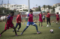 Women players of Fath Union Sport soccer team take part in a training session in Rabat, Morocco, Friday, May 19, 2023. (AP Photo/Mosa'ab Elshamy)