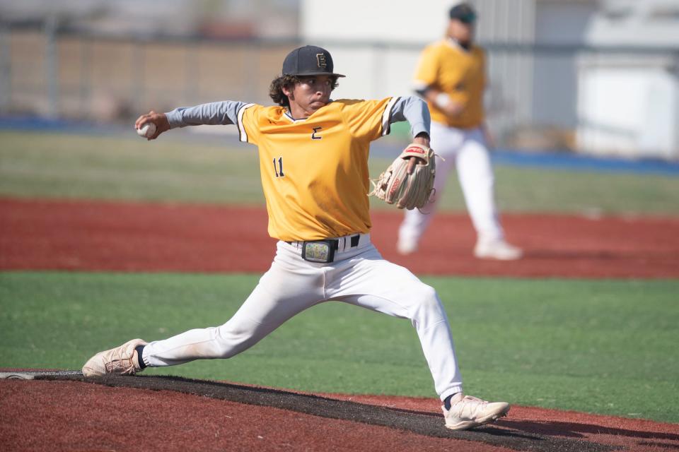 Pueblo East's Michael Casillas winds up for a pitch during a matchup with Pueblo West on April 26, 2022.