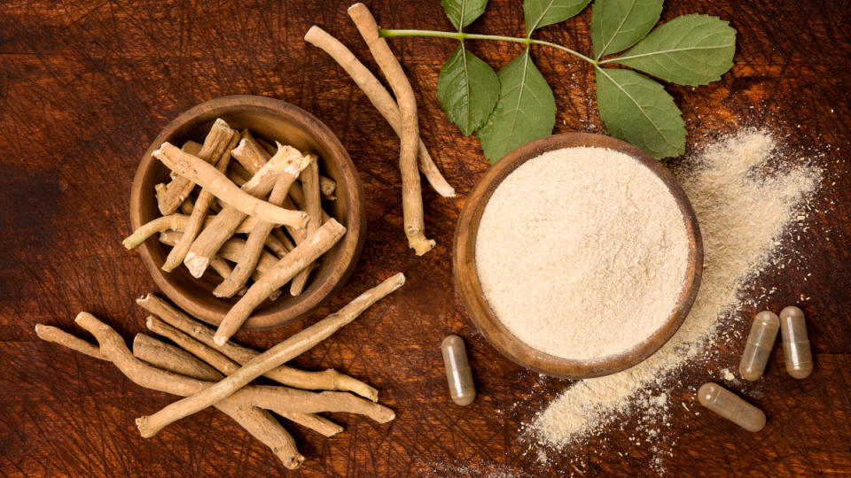 Powdered ashwagandha next to ashwagandha root and pills, which is good for sleep