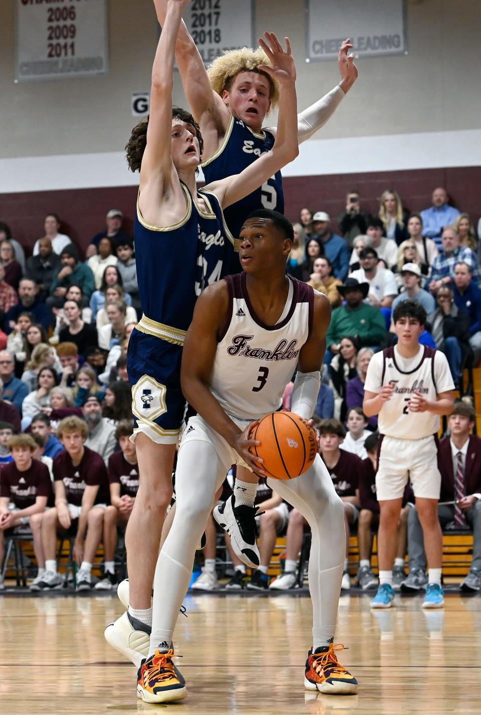 Franklin's Christian Brown (3) attempts to shoot as Independence's Houston Hicks (34) and Tylan Lewis (5) defend during an high school basketball game Friday, Jan. 12, 2024, in Franklin, Tenn.