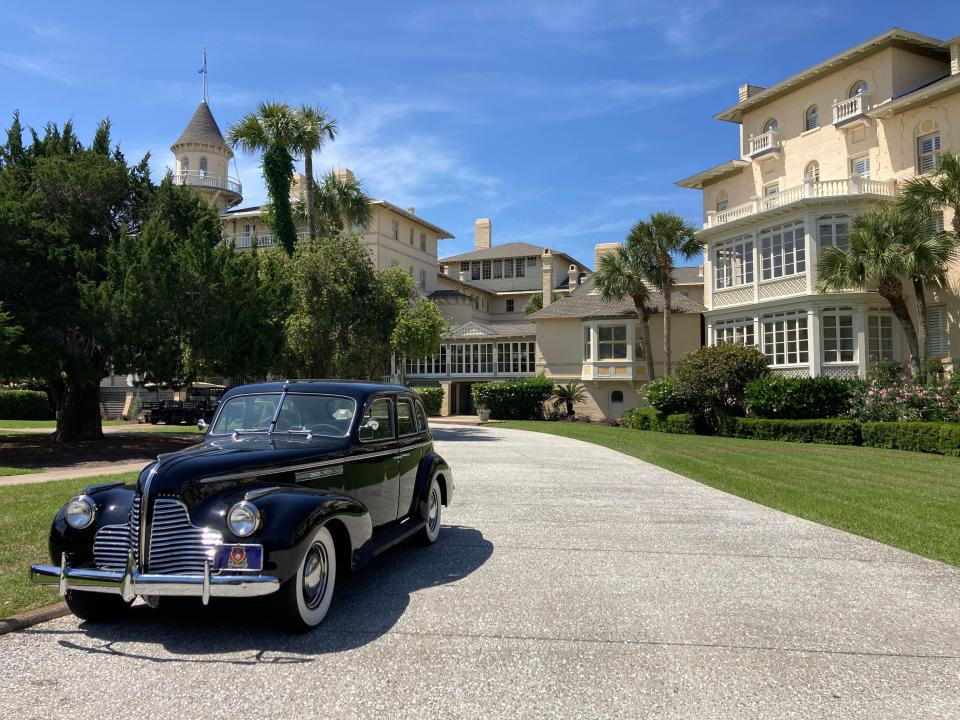 Entrance to the Jekyll Island Club Hotel, the car is historic and remains as memento.