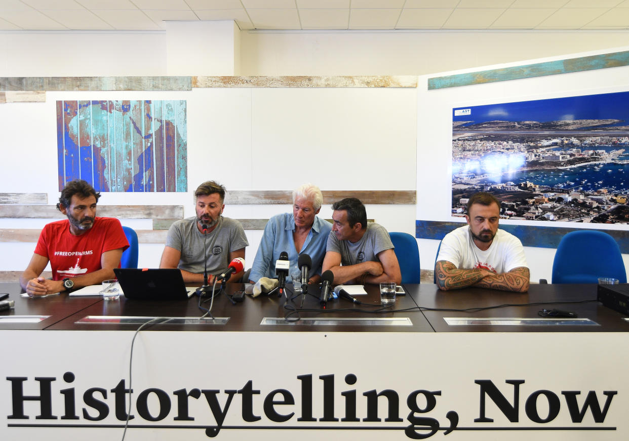 Founder and director of Proactiva Open Arms NGO Oscar Camps, Head of mission of Proactiva Open Arms NGO Riccardo Gatti, U.S. actor Richard Gere and Italian chef Gabriele Rubini, attend a news conference in support of an NGO ship "Open Arms", which carries stranded migrants, in Lampedusa, Italy, August 10, 2019. REUTERS/Guglielmo Mangiapane
