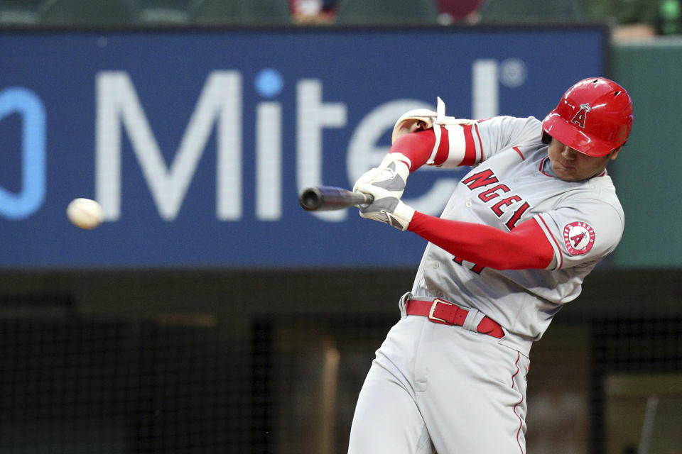 Los Angeles Angels' Shohei Ohtani (17) connects for a two-RBI double in the second inning against the Texas Rangers during a baseball game on Monday, April 26, 2021, in Arlington, Texas. (AP Photo/Richard W. Rodriguez)