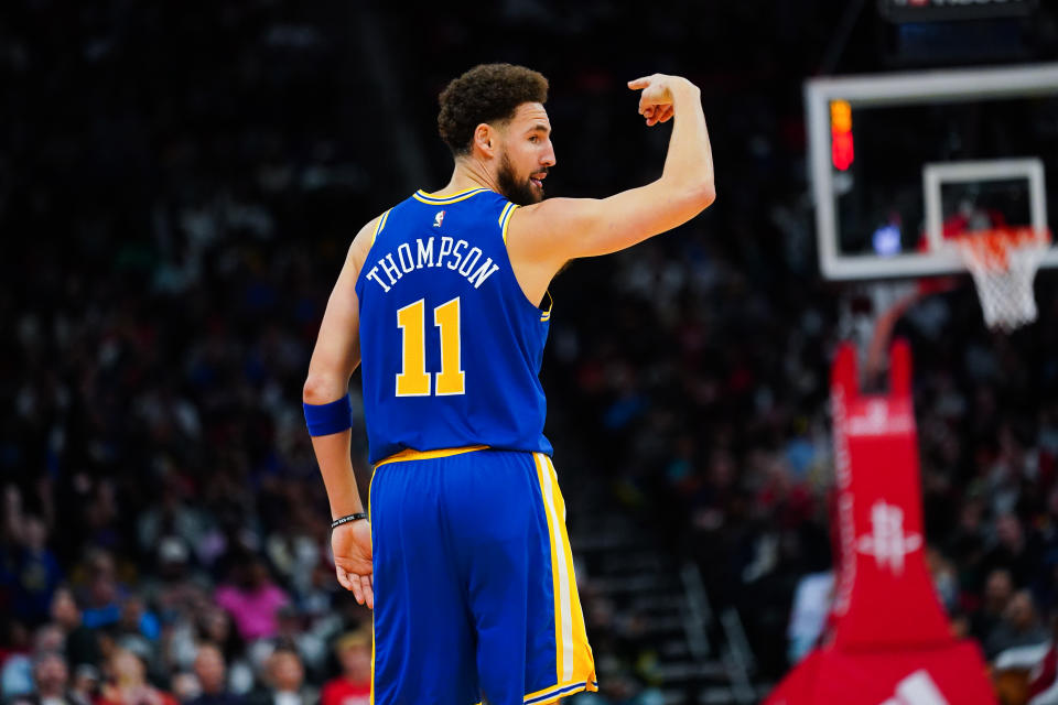 HOUSTON, TEXAS - NOVEMBER 20: Klay Thompson #11 of the Golden State Warriors reacts after sinking a three point shot in the third quarter of the game against the Houston Rockets at Toyota Center on November 20, 2022 in Houston, Texas. NOTE TO USER: User expressly acknowledges and agrees that, by downloading and or using this photograph, User is consenting to the terms and conditions of the Getty Images License Agreement. (Photo by Alex Bierens de Haan/Getty Images)