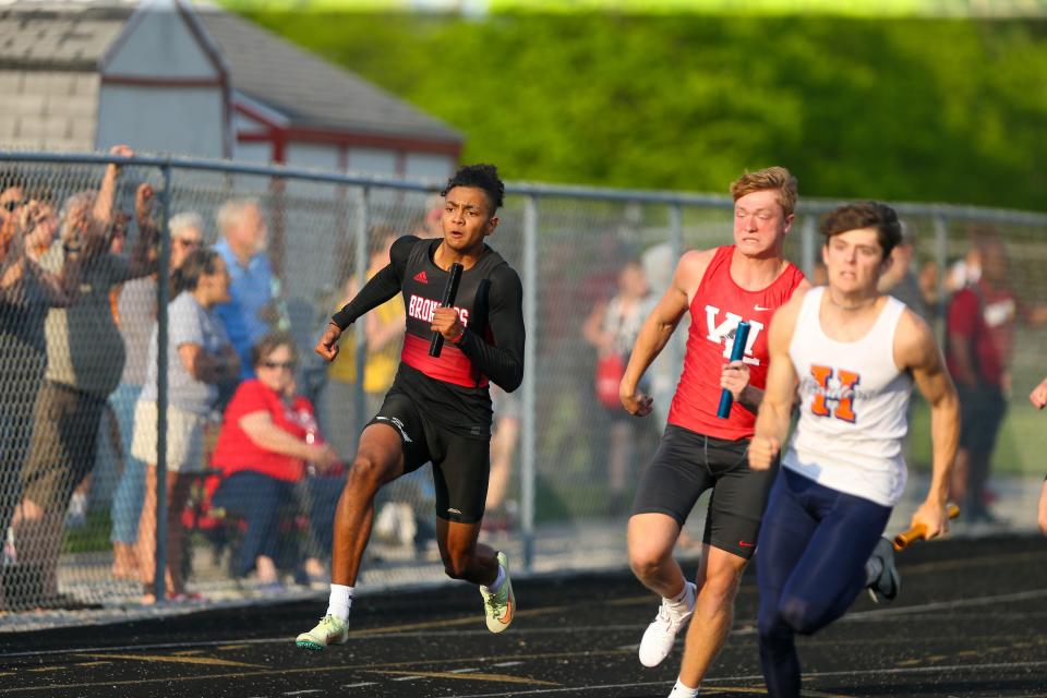 Micah Lillard (10), Lafayette Jefferson High School, and Nathan Myers (11) West Lafayette High School, fight for second place as Connor Czajkowski (12), Harrison High School, pulls away in the 4x100 Meter Relay at the 2022 IHSAA Boys Track and Field Sectional at West Lafayette Athletic Complex, on May 19, 2022, in West Lafayette.