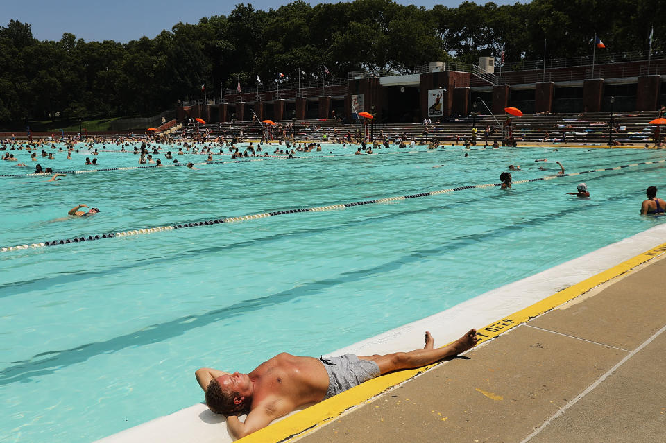 Will scenes like this one, of a public pool in Queens, New York, be a source of great risk this summer? (Photo: Spencer Platt/Getty Images)