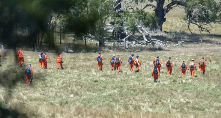 Seen here is a group searchers in Ballarat looking for traces of Samantha Murphy. 