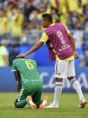 <p>Colombia’s Carlos Bacca, right, consoles Senegal’s Salif Sane at the end of the group H match </p>