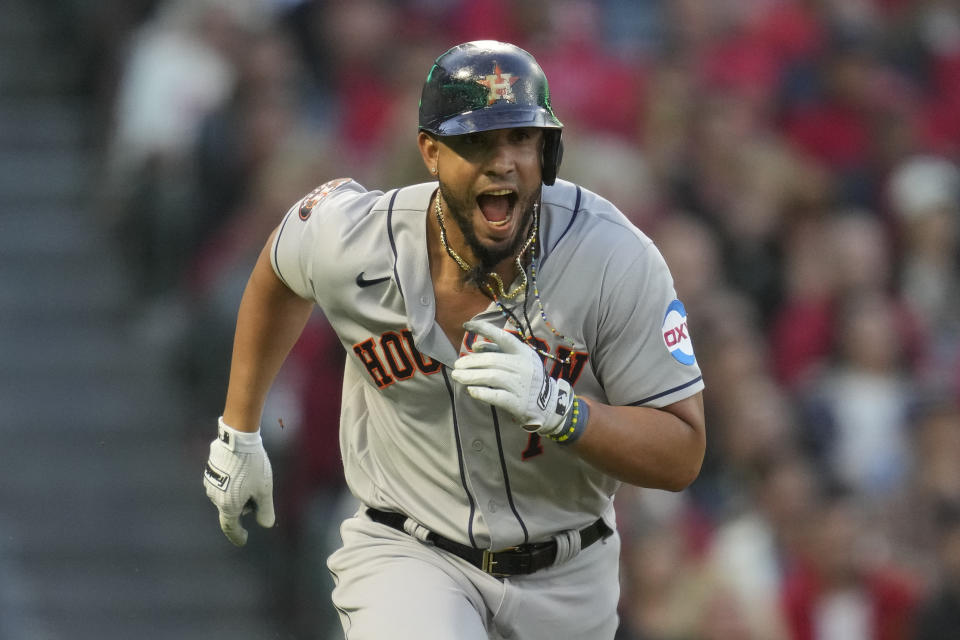 Houston Astros' Jose Abreu (79) reacts to a fielding error by Los Angeles Angels right fielder Hunter Renfroe as he runs to first during the third inning of a baseball game in Anaheim, Calif., Monday, May 8, 2023. Yordan Alvarez scored. (AP Photo/Ashley Landis)