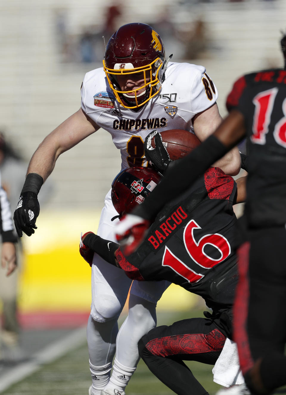 Central Michigan tight end Bernhard Raimann (86) is sacked by San Diego State cornerback Luq Barcoo (16) during the first half of the New Mexico Bowl NCAA college football game on Saturday, Dec. 21, 2019 in Albuquerque, N.M. (AP Photo/Andres Leighton)