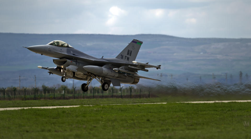 FILE - In this Thursday, April 10, 2014 file picture, an US F16 fighter jet takes off from a Romanian air base in Campia Turzii, Romania. The U.S. Air Force has deployed on Monday, Jan. 4, 2021, about 90 airmen and an unspecified number of drone aircraft to a base in central Romania, boosting its military presence in the region where there are allied concerns that Russia is trying to display its military strength. (AP Photo/Vadim Ghirda, File)