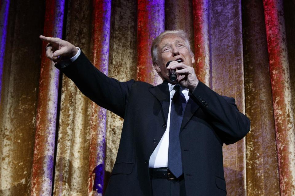 President-elect Donald Trump speaks during the presidential inaugural Chairman's Global Dinner, Tuesday, Jan. 17, 2017, in Washington. (AP Photo/Evan Vucci)