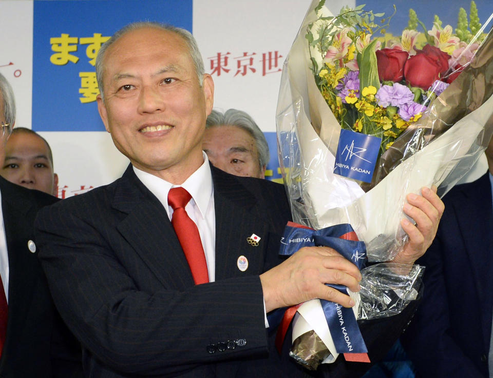 Former Health Minister Yoichi Masuzoe celebrates his gubernatorial election victory at his election office in Tokyo, Sunday, Feb. 9, 2014. Masuzoe, backed by Japan's ruling party, won Tokyo's gubernatorial election on Sunday, defeating two candidates who had promised to end nuclear power. (AP Photo/Kyodo News) JAPAN OUT, MANDATORY CREDIT