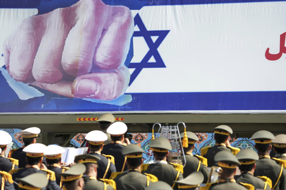 An anti-Israeli banner is carried on a truck during Iranian Army Day parade in front of the mausoleum of the late revolutionary founder Ayatollah Khomeini just outside Tehran, Iran, Tuesday, April 18, 2023. Iran's President Ebrahim Raisi on Tuesday reiterated threats against Israel while marking the country's annual Army Day, though he stayed away from criticizing Saudi Arabia as Tehran seeks a détente with the kingdom. (AP Photo/Vahid Salemi)