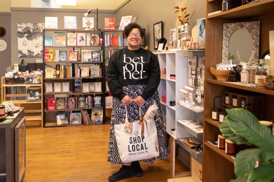 Owner Tiffany Blackman poses with products at Bread & Basket in downtown Battle Creek on Tuesday, Nov. 14, 2023.