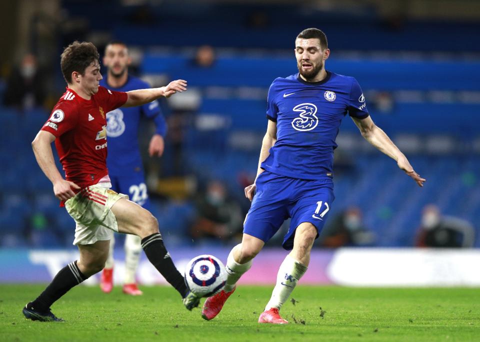 Chelsea's Mateo Kovacic, right, and Manchester United's Victor Lindelof challenge for the ball during the English Premier League soccer match between Chelsea and Manchester United at Stamford Bridge Stadium in London, England, Sunday, Feb. 28, 2021. (AP Photo/Ian Walton, Pool)