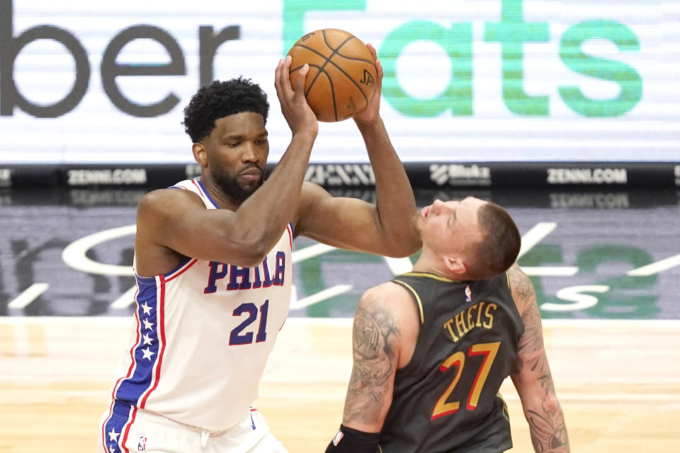 Philadelphia 76ers' Joel Embiid (21) clips Chicago Bulls' Daniel Theis' chin with his elbow as he pulls the ball up to shoot during the second half of an NBA basketball game Monday, May 3, 2021, in Chicago. (AP Photo/Charles Rex Arbogast)