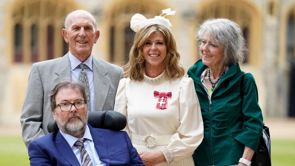 Kate Garraway with Derek Draper and her parents after being made an MBE 