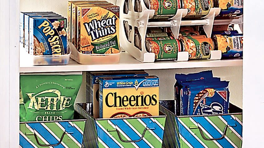 cereal and snacks organized in boxes in the pantry