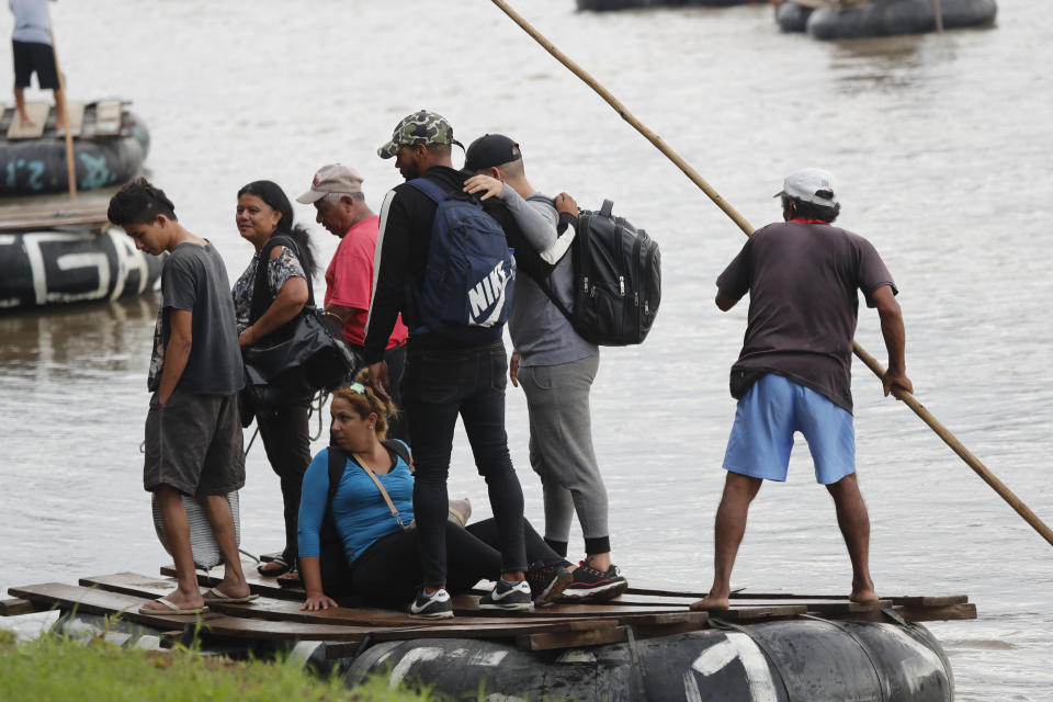 Cuban migrants land on the Mexican side of the Suchiate River on the border with Guatemala, after crossing on a raft near Ciudad Hidalgo, Mexico, early Tuesday, June 11, 2019. Mexican officials say they are beginning deployment of 6,000 National Guard troops for immigration enforcement, an accelerated commitment made as part of an agreement with the United States last week to head off threatened U.S. tariffs on imports from Mexico. (AP Photo/Marco Ugarte)