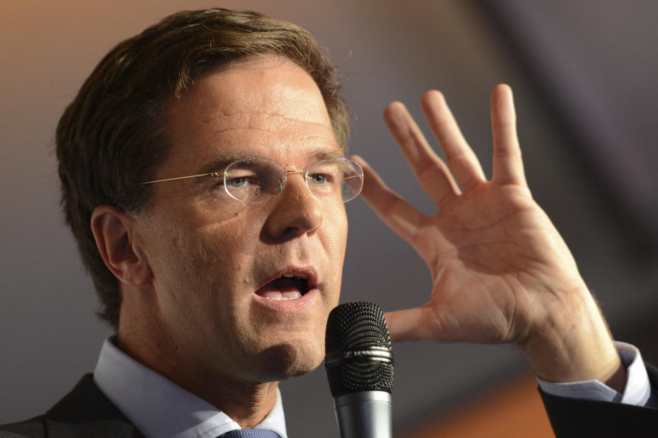 Dutch prime minister and Liberal Party leader Mark Rutte addresses supporters after exit poll results for the parliamentary elections were announced in The Hague, Netherlands, Wednesday Sept. 12, 2012. An exit poll commissioned by the two biggest Dutch news broadcasters has predicted a narrow election victory for the Prime Minister Mark Rutte's free-market VVD party. The exit poll, which will be updated with late votes, gave the VVD 41 of the House of Representatives' 150 seats and the center-left Labor Party 40 votes. The poll has a 1.5 percent margin of error, and the broadcasters said the final result was still too close to call. (AP Photo/Ermindo Armino)