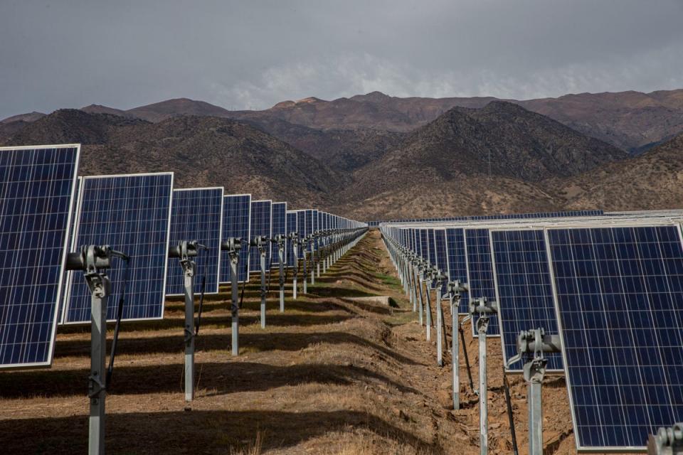 Solar panels stand in the Quilapilún solar energy plant, a joint venture by Chile and China, in Colina, Chile (AP)