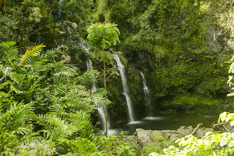 FILE- In this Sept. 24, 2014, file photo, are three waterfalls by the Hana Highway near Hana, Hawaii. So many tourists are flocking to Maui now that coronavirus pandemic concerns have eased in the United States that islanders are feeling overwhelmed and Maui's mayor is begging airlines to cut back on the number of people they fly to the island. (AP Photo/Marco Garcia, File)