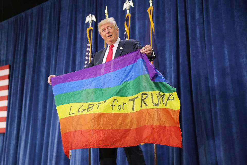 Image: Republican presidential nominee Donald Trump holds a rainbow flag (Chip Somodevilla / Getty Images file)