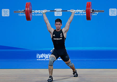 Cameron Mctaggart of New Zealand competes in the Men's 69kg Weightlifting on day three of the Nanjing 2014 Summer Youth Olympic Games.