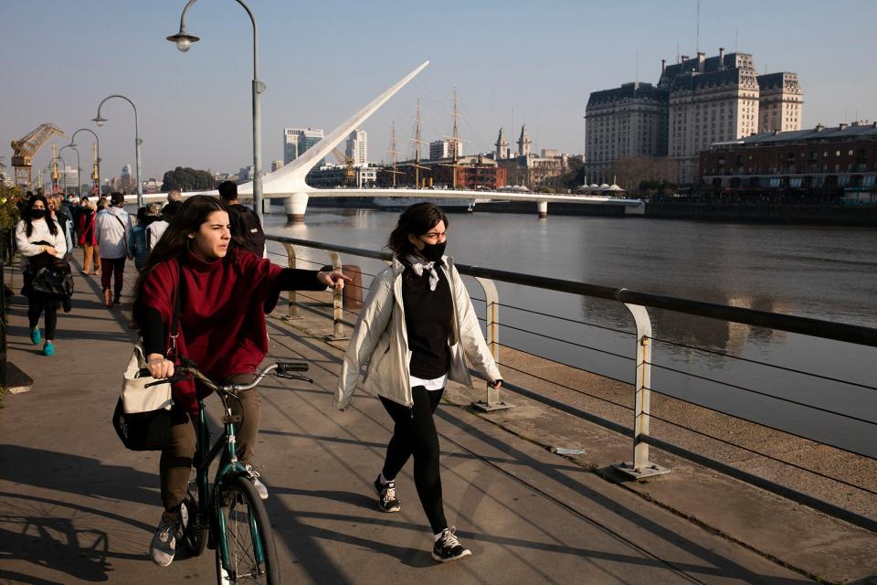 Tourists walks in the waterfront of Puerto Madero on August 01, 2021 in Buenos Aires, Argentina