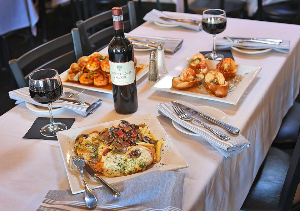 A full diner table at Campanale's- Seafood Fra Diavlo, Chicken Gorgonzola and Shrimp Scampi Bruschetta with a red wine.

Let's Eat- Campanale's Italian Restaurant on Pearl Street, Braintree has been serving fine Italian dishes for 47 years. Monday Feb. 5, 2024