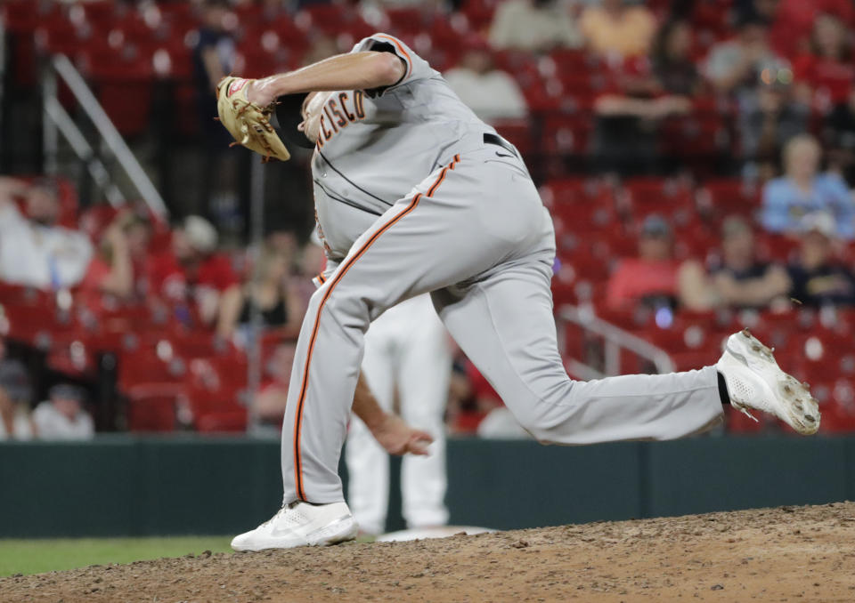 San Francisco Giants relief pitcher Tyler Rogers delivers a submarine pitch in the ninth inning of a baseball game against the St. Louis Cardinals, Friday, July 16, 2021, in St. Louis. (AP Photo/Tom Gannam)