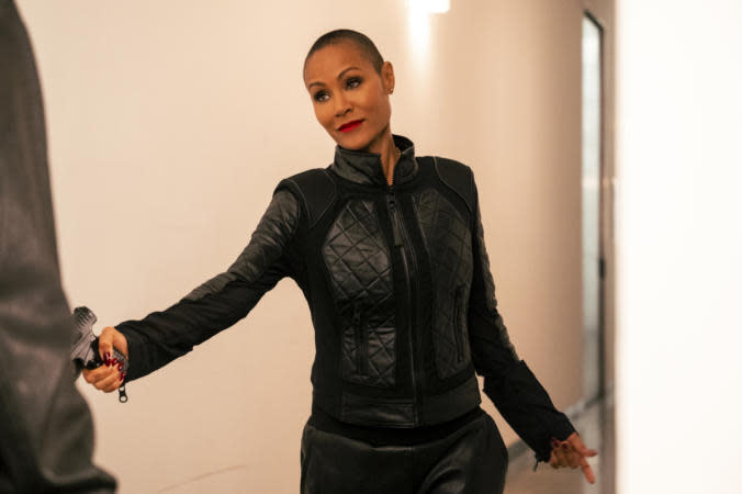 Take a look through some of the movies and tv shows that launched Jada Pinkett Smith into such a successful career. Pictured: Jada Pinkett Smith wearing a long sleeve black dress and posing. | Photo: JoJo Whilden/CBS