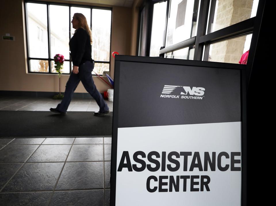 Those affected by the Feb. 3 Norfolk Southern train derailment file into Abundant Life Fellowship to receive reimbursement Friday in New Waterford, Ohio.