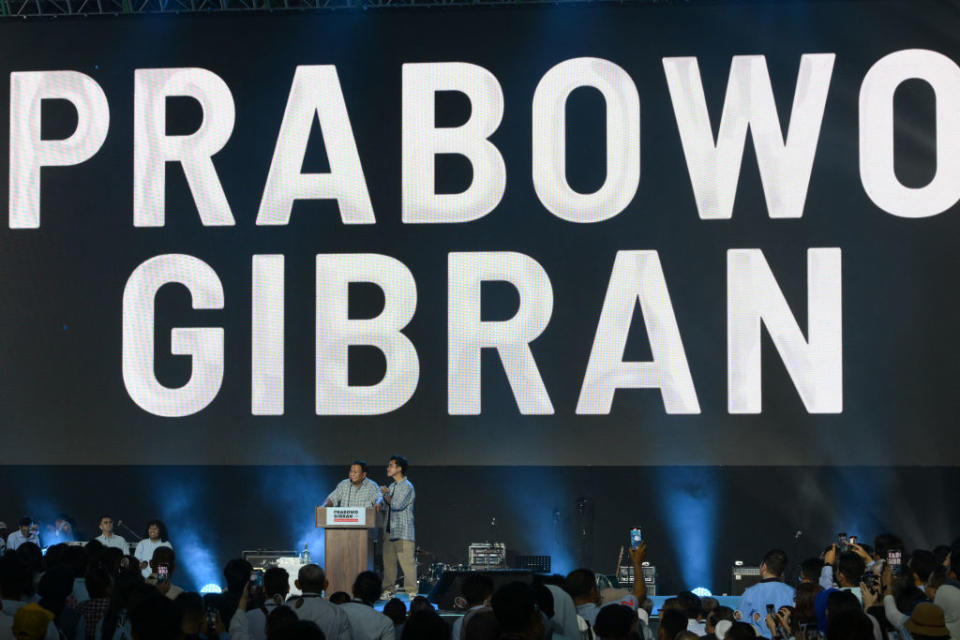 Presumed Indonesian President-elect Prabowo Subianto addresses supporters next to his vice presidential running mate Gibran Rakabuming Raka, in Jakarta on Feb. 14, 2024.<span class="copyright">Bay Ismoyo—AFP/Getty Images</span>