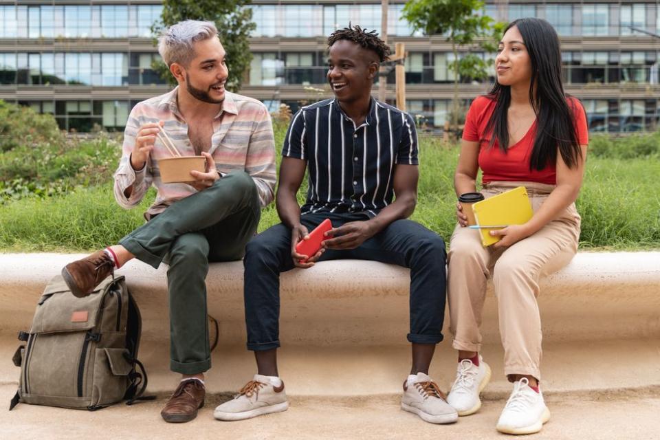 three queer people sitting together